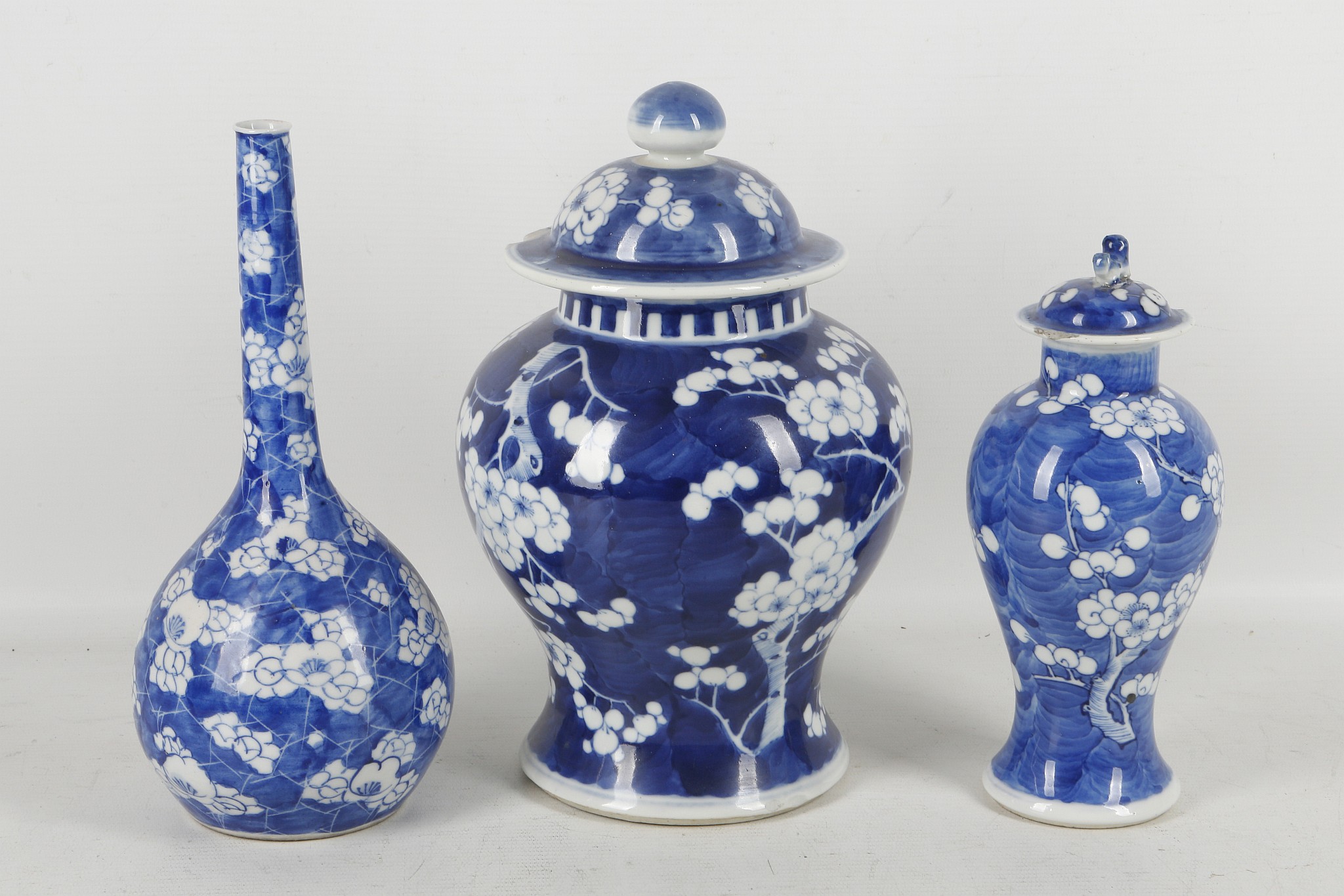 Three Chinese blue and white prunus decorated vases, two of baluster form with covers, one of pear - Image 2 of 4