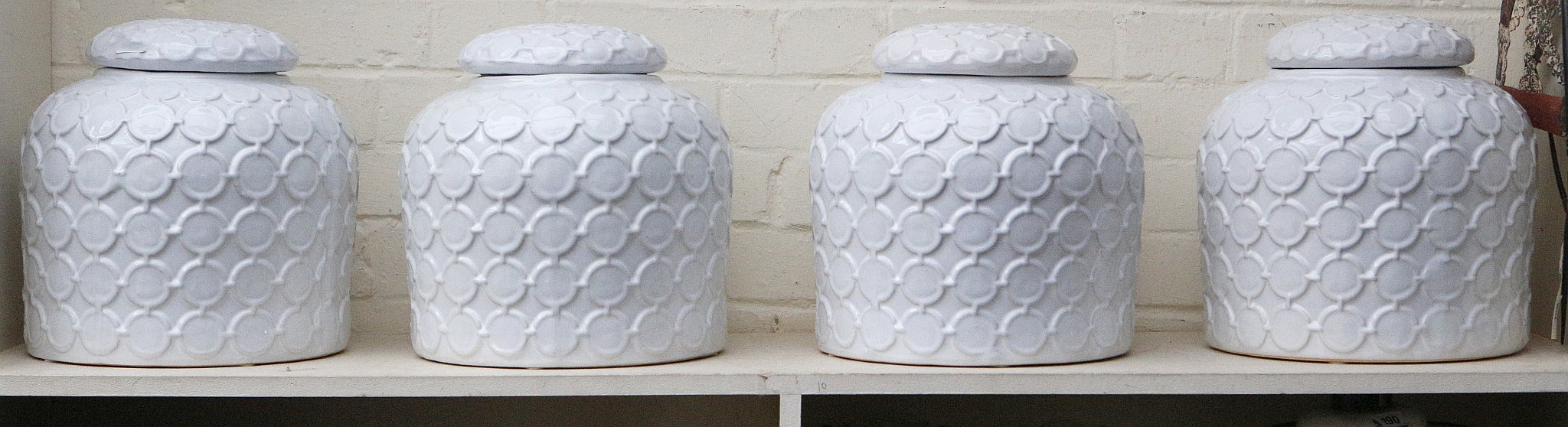 A Set of four oversized ceramic storage / ginger jars, domed lid, conjoined circular decoration,