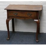 A Victorian mahogany side table with single drawer, on two front cabriole legs.