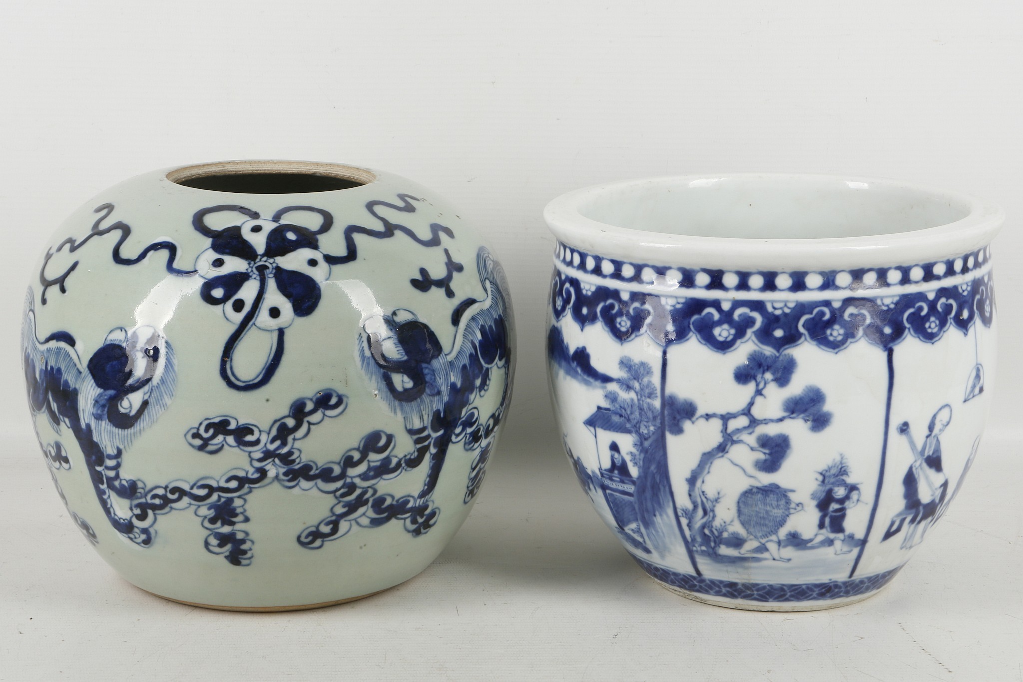 A Chinese blue and white figurative jardinere, together with a celadon blue and white Fo dog