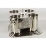 A silver plate four bottle wine cooler.