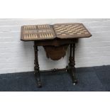 A mid Victorian games table, burr walnut folding top revealing backgammon, chess and cribbage,