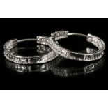 A pair of 18ct white gold and diamond set hoop earrings. Diamond: 1.5 - 1.8ct total est.