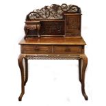 A CHINESE ROSEWOOD WRITING DESK. Late 19th / early 20th Century. With two drawers, cabriole legs and