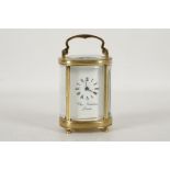 A late 20th century, brass and five glass, oval section carriage clock, by Charles Frodsham, with