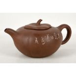 A Chinese Yixing Zesha lobed pumpkin teapot and cover, one side incised with a calligraphic