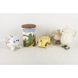 A collection of four 1930's and later novelty teapots and a Crown Devon biscuit barrel by Robin Cody