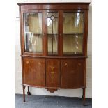 A late 19th century display cabinet, bow double glazed doors with satinwood inlay, urn and swag