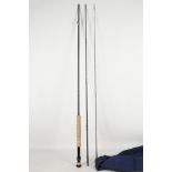 A Sage three piece 'Graphite III' high spinning / flyrod (9ft long with cloth bag and aluminium