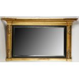 A late Regency overmantle mirror, half columns with foliate decoration flanking a reeded and