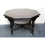 A black lacquered 19th century table, with tooled leather top, raised on turned legs, 121 W x 73cm