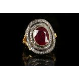A 14k gold, ruby and diamond cluster dress ring. Ruby: treated. Size: Q½.