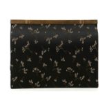 1950s CARTIER CLUTCH BAG, black floral brocade on