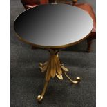 A mirrored top occasional table, raised on a gilt