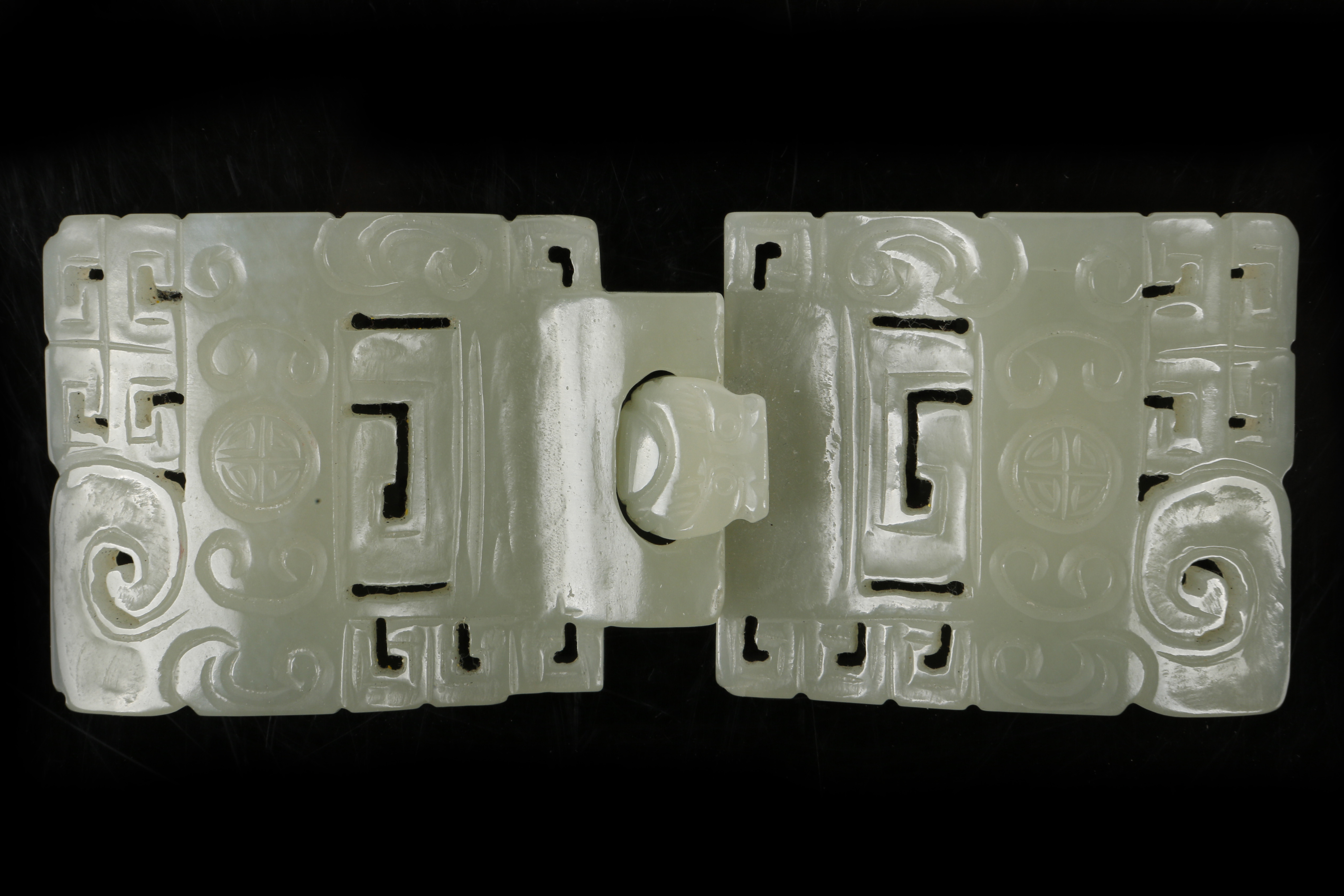 A Chinese carved and pierced jade sectional belt b