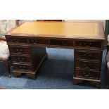 A 20th century twin pedestal desk, leather top, 13