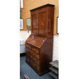 A 19th century mahogany bureau with related cabine