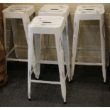 A set of four white painted bar stools, the square section top raised on square section legs.