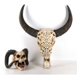 Two composition mythical beast sculls with horns,