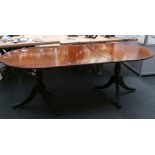 A Regency style dining table with cross banded edg