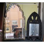 A late 19th century strut mirror, the arched top w