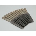 A set of twelve Antique Edwardian Sterling Silver handled dessert knives by Harrison Brothers &