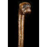 A CHERRY WALKING CANE. With bulldog portrait (with