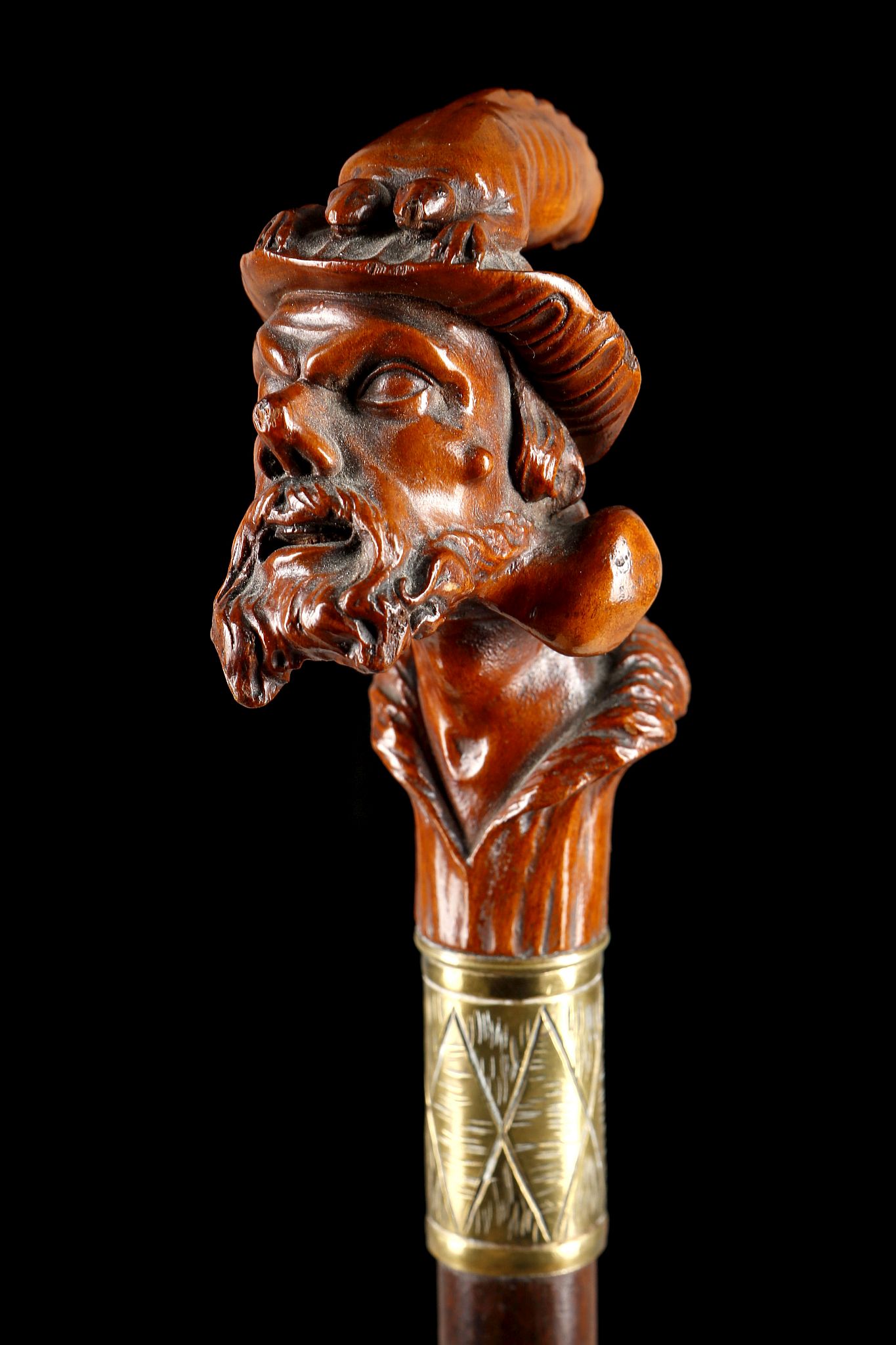 A 19TH CENTURY CONTINENTAL FIGURATIVE HANDLED CANE