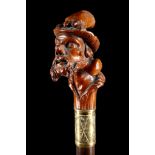 A 19TH CENTURY CONTINENTAL FIGURATIVE HANDLED CANE