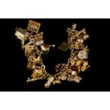 A 9ct gold 29 piece charm bracelet, with all 9ct g