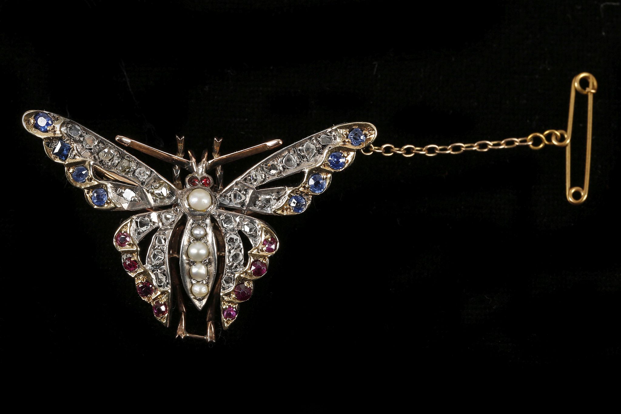 A late Victorian, gold butterfly pendant / brooch,