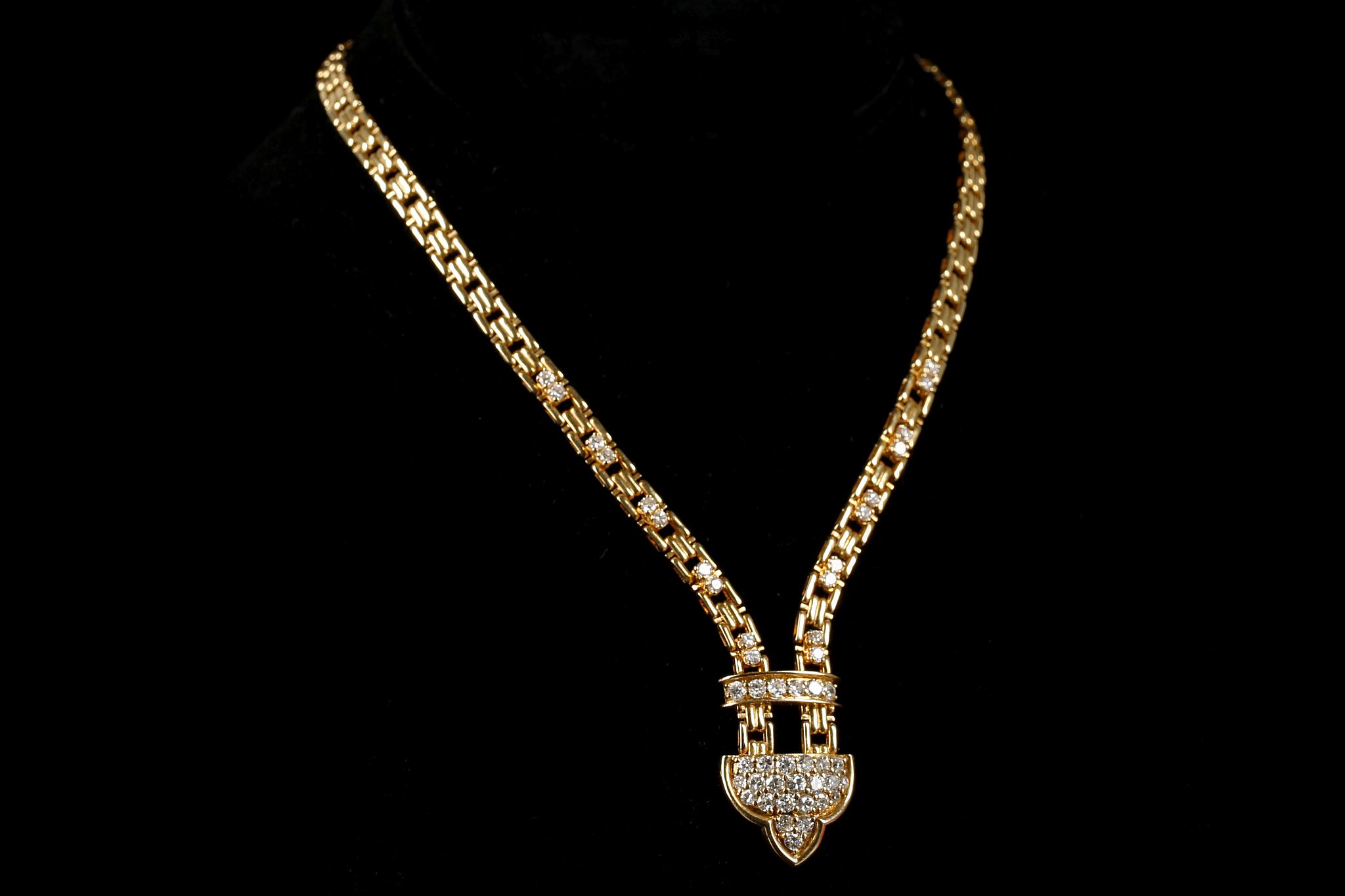 A French 18ct gold and diamond pendant necklace, t