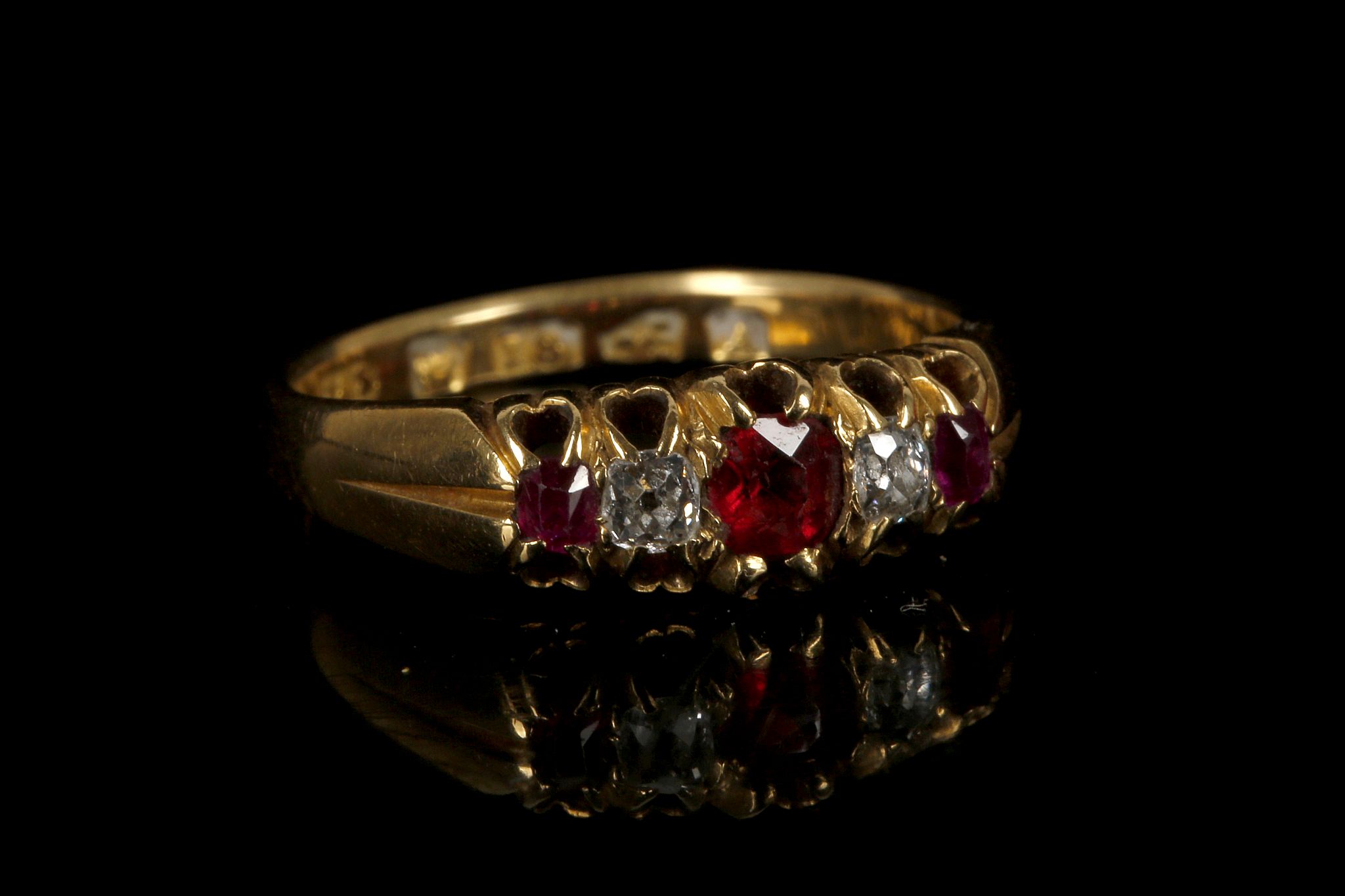 A Victorian 18ct gold, ruby and diamond five stone