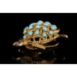 A 'Cartier' 18 carat gold tortoise brooch, set wit