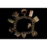 A 9ct gold, 9 piece charm bracelet, with mostly 9c