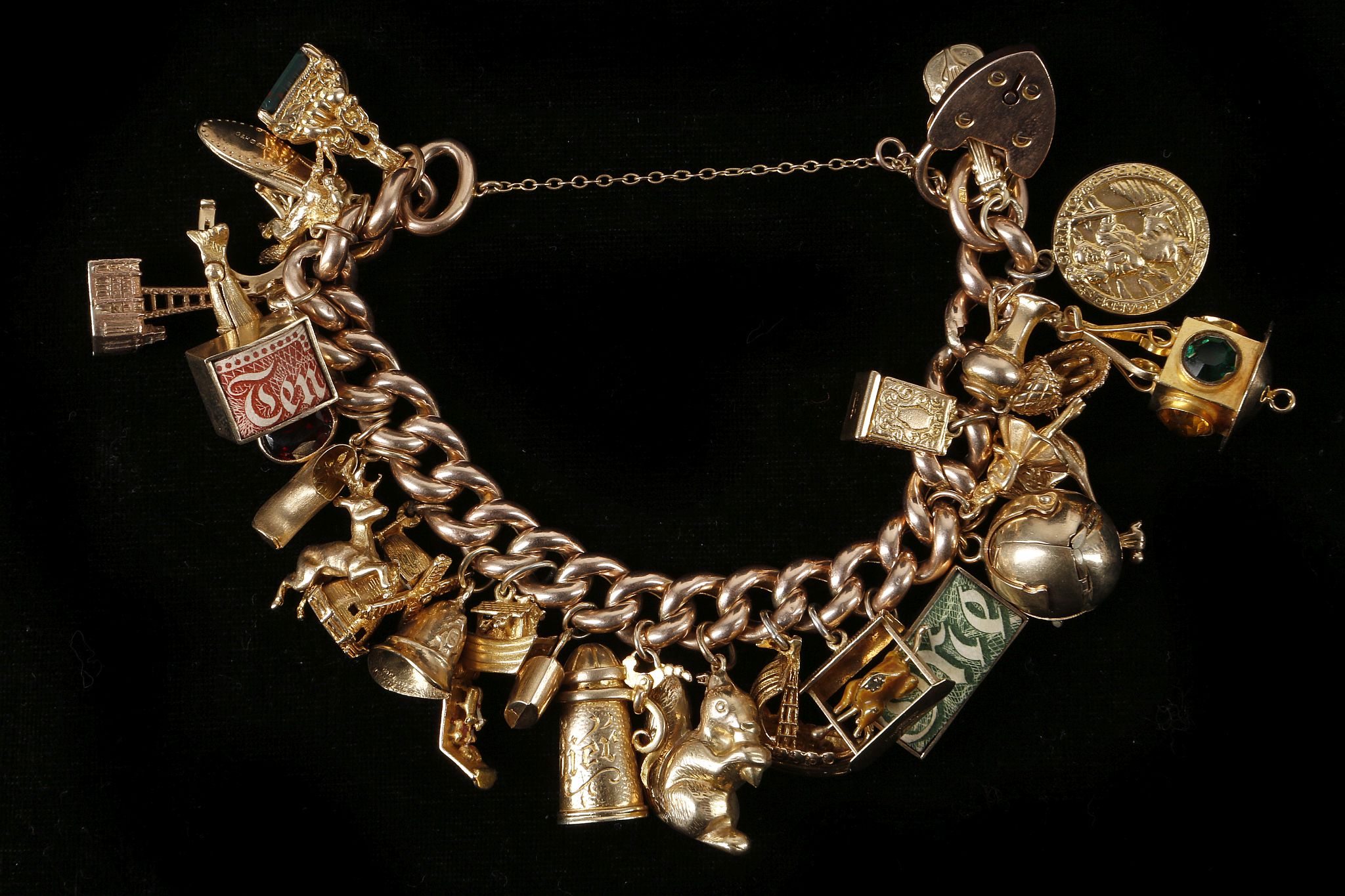 A 9ct rose gold, 29 piece charm bracelet with all - Image 2 of 2