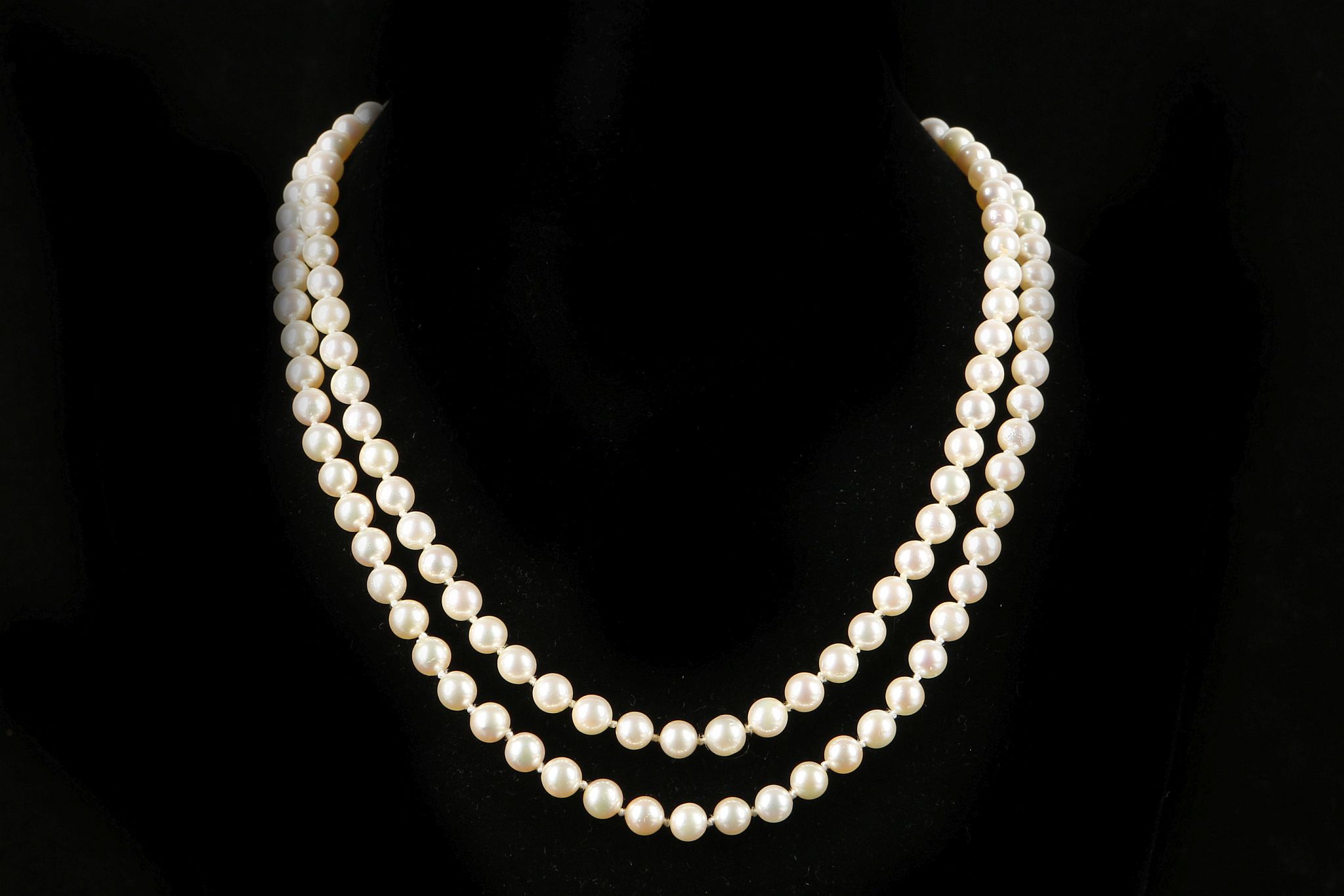A single strand opera length, cultured rose pearl