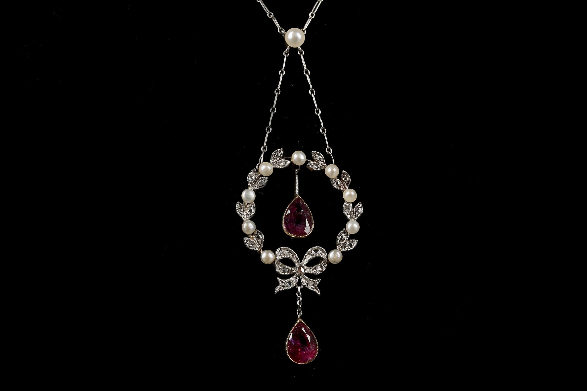 An Edwardian gold, pink sapphire, diamond and pear