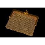 An early 20th century French 18ct gold mesh purse,