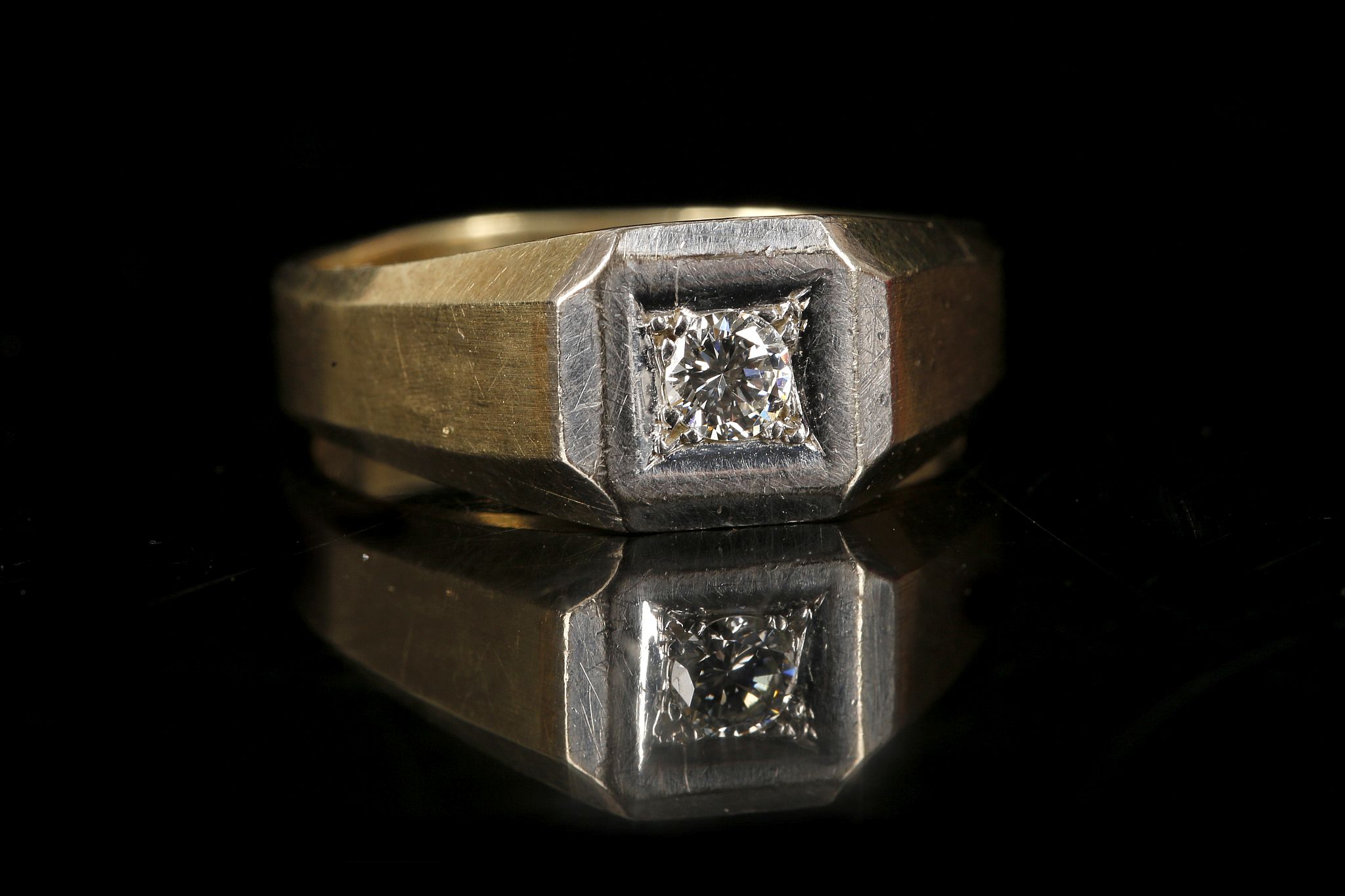 A gent's 14k gold and diamond set signet ring. Dia