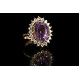 An 18ct yellow gold, amethyst and diamond cluster