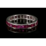 An Art Deco white gold and ruby set, full eternity