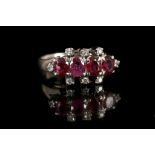 A silver, diamond, and ruby ring, set four oval cut natural rubies and six small round cut diamonds,