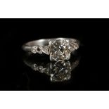 A vintage platinum and diamond engagement ring, th