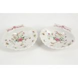 A pair of 18th century Qing Dynasty famille rose shell-shaped dishes, finely painted with oriental