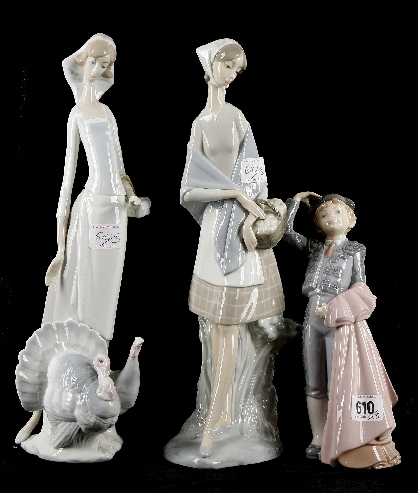 Three Lladro porcelain figures to include a boy ma