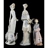 Three Lladro porcelain figures to include a boy ma