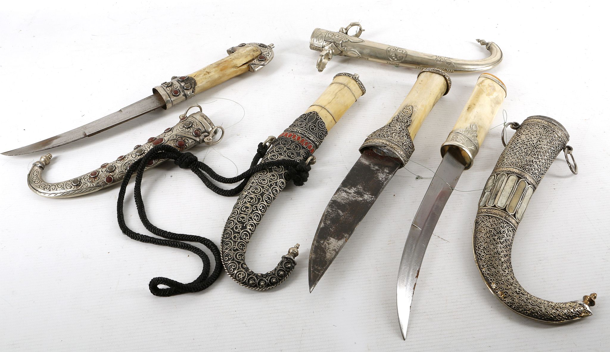 Four bone handle Islamic khanjar daggers, turquois