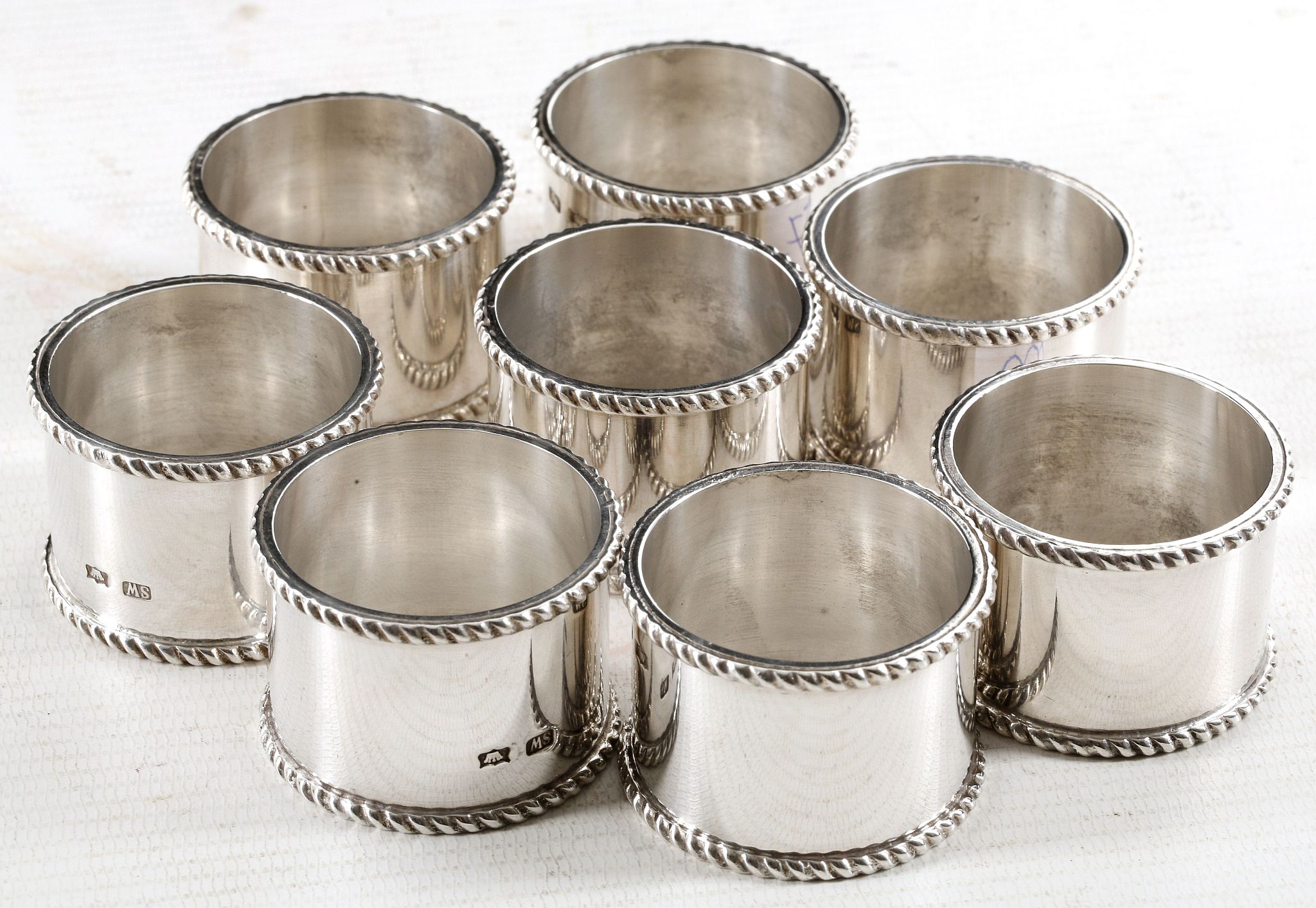 A collection of 8 continental sterling silver napk