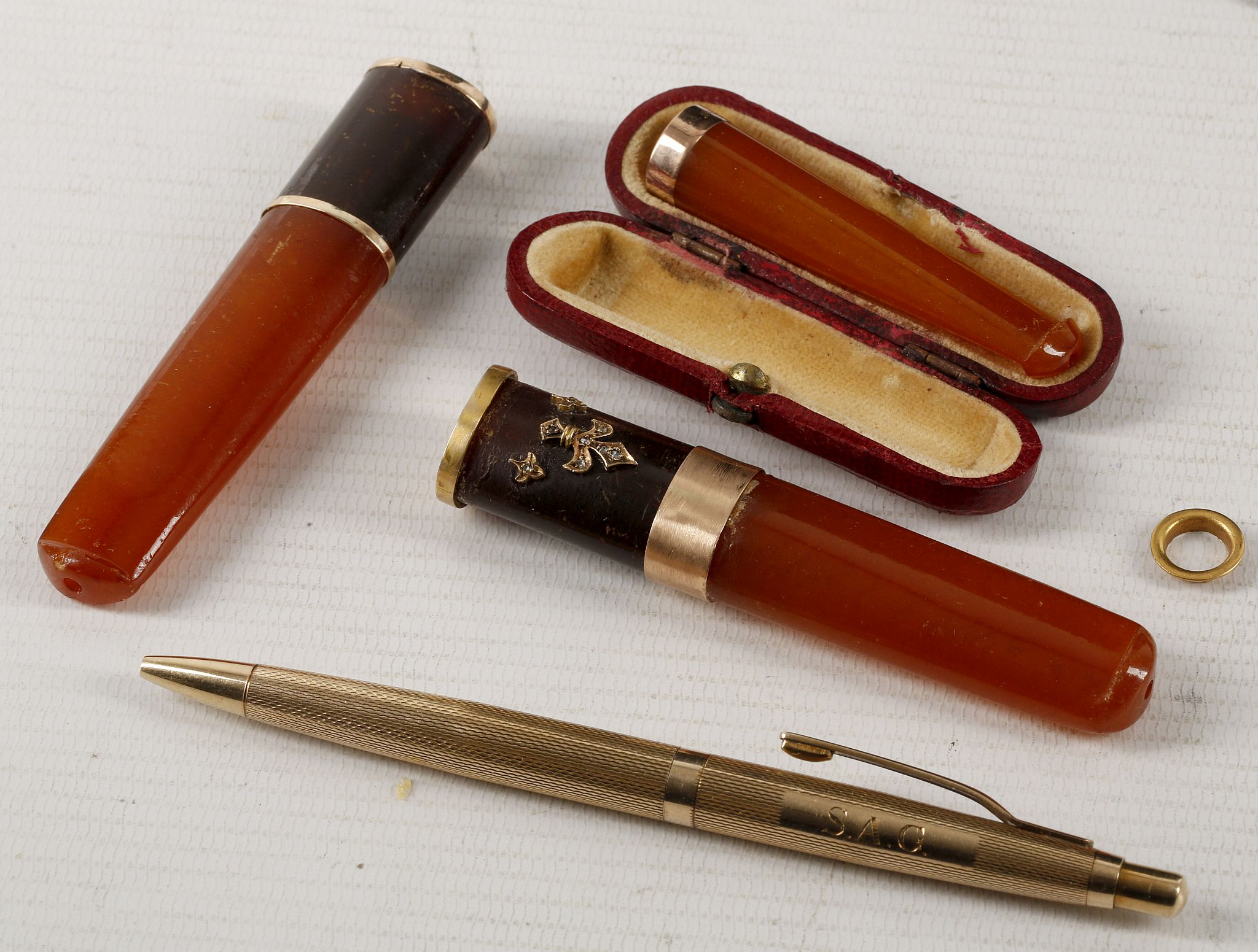 A mid 20th century 9ct gold pen, together with a c